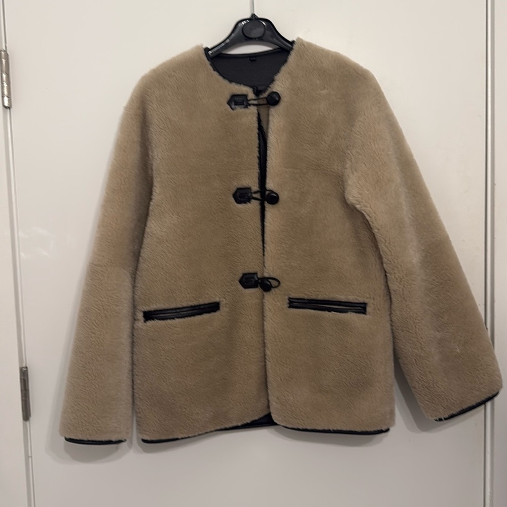 Funnel Neck Shearling jacket with leather detail
